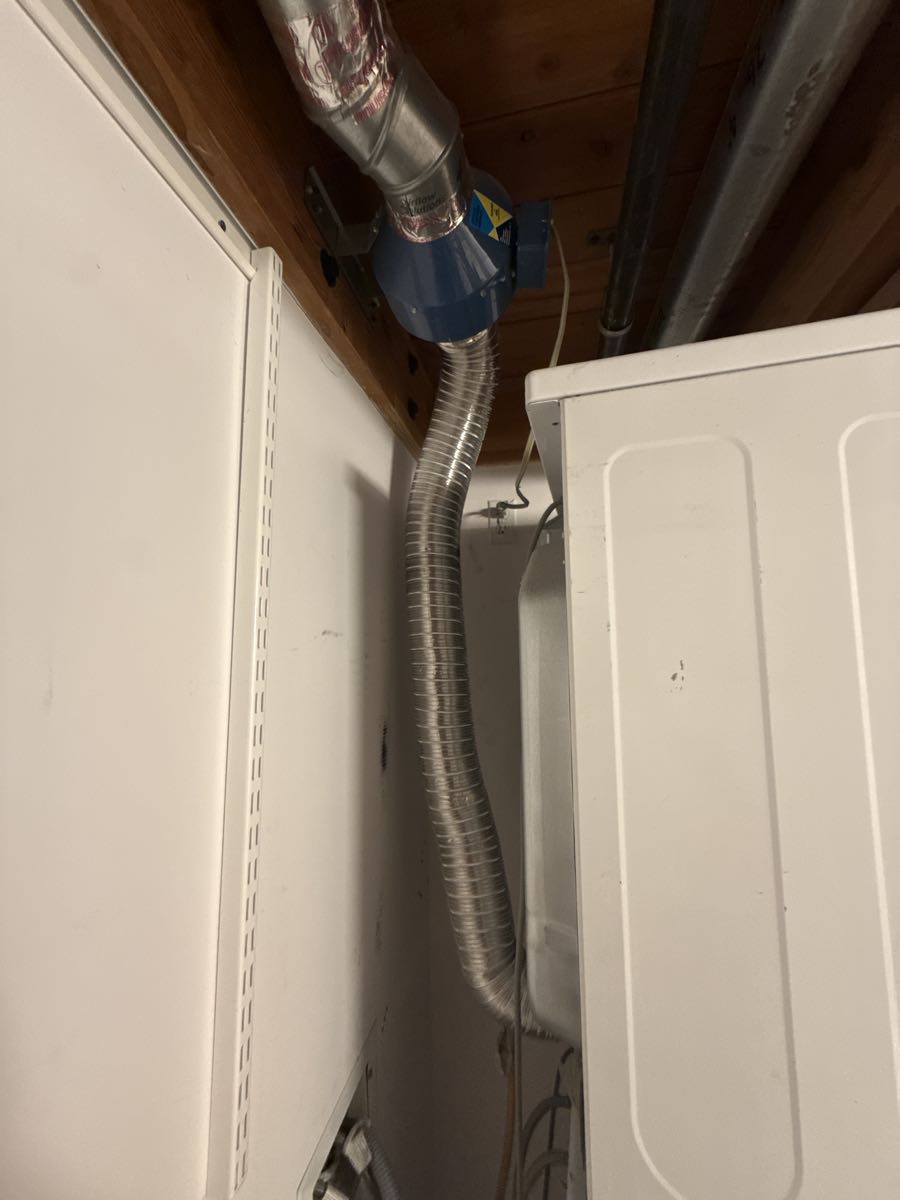 Before cleaning: dryer vent interior showing lint accumulation